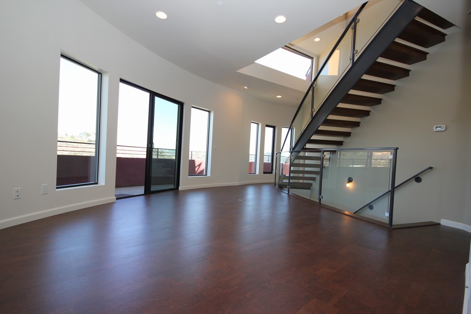 great room beautiful suspended stairway